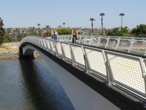 Bicyclists enjoying the Mike Gotch Memorial Bridge spanning Lower Rose Creek.